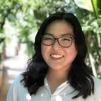 Profile picture of Sydney Fujioka against a background of out of focus trees